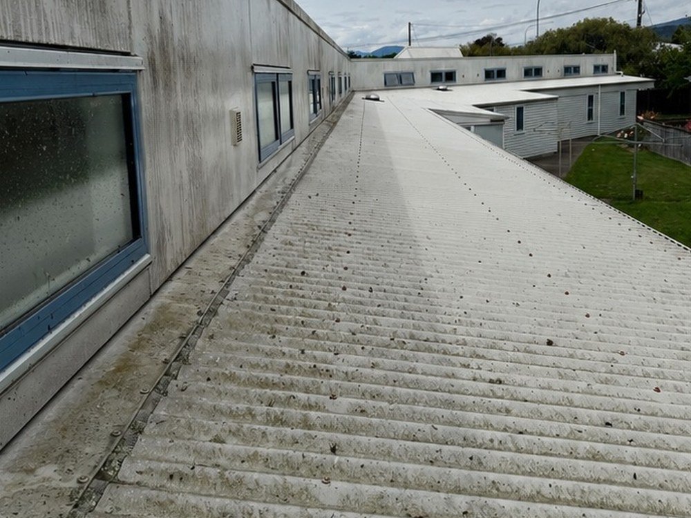 Commercial building roof and cladding before house washing, Wellington